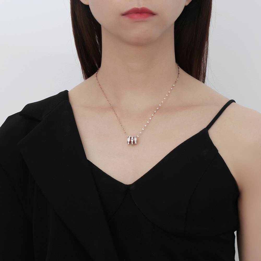 Stainless steel 18K gold plated three-ring diamond-encrusted necklace: a versatile and affordable luxury piece for everyday wear.
