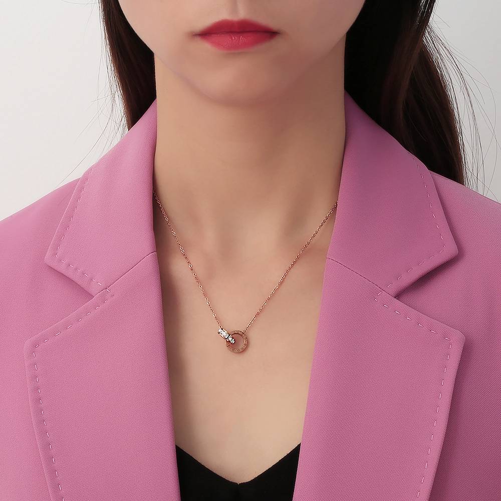 Stainless steel Roman numeral necklace plated with 18K gold: A touch of understated luxury is all the rage.